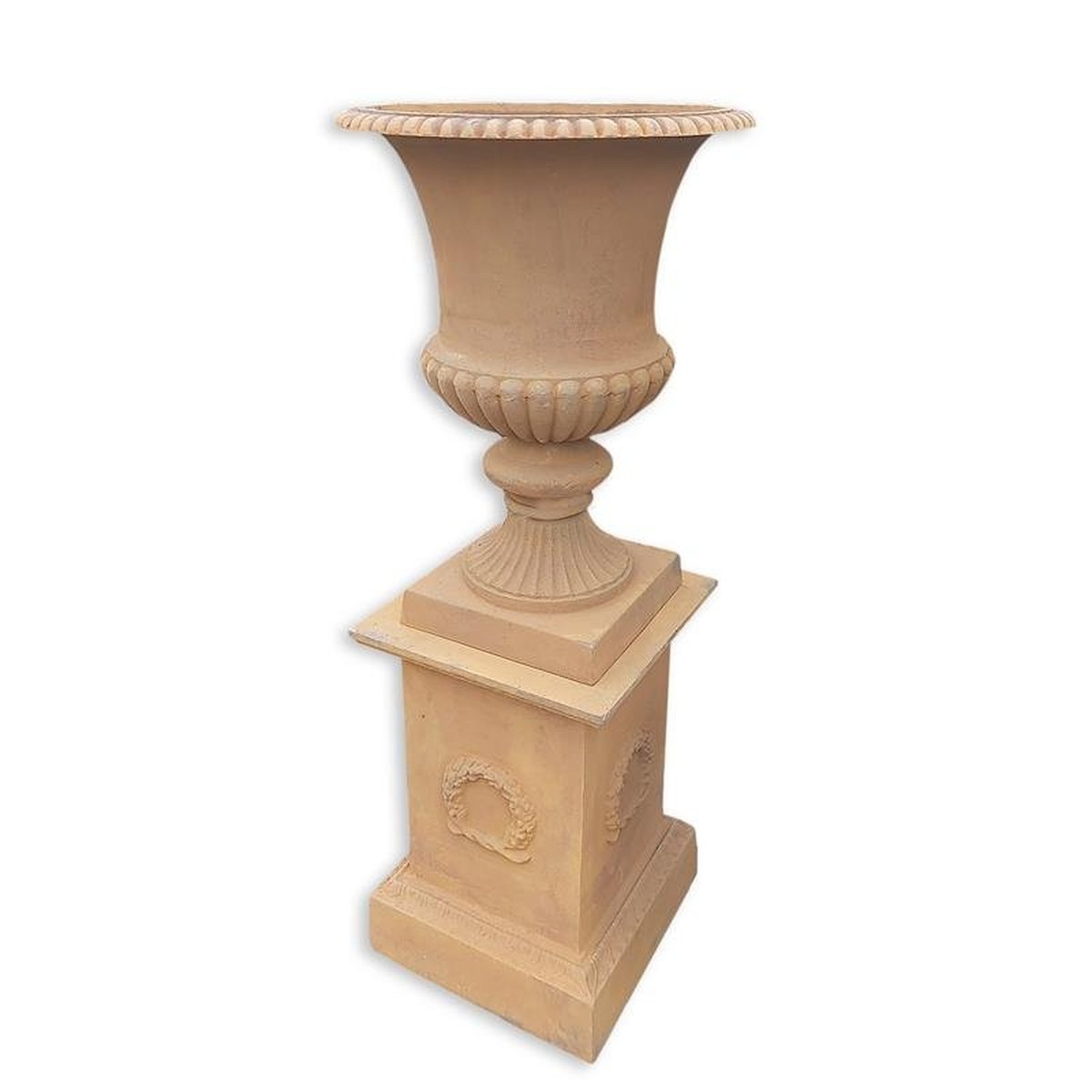 A CAST GARDEN URN ON A BASE