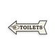A CAST IRON ARROW SIGN TOILETS""