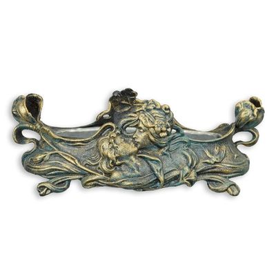 A CAST IRON ART NOUVEAU PLANTER WITH TIN INLAY