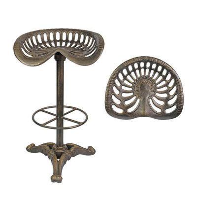 A CAST IRON BAR STOOL  BRONZE COLOUR