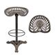 A CAST IRON BAR STOOL - BRONZE COLOUR