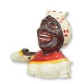 A CAST IRON BLACK GIRL MECHANICAL BANK