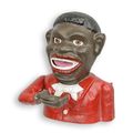 A CAST IRON BLACK MAN MECHANICAL BANK