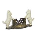 A CAST IRON CARD HOLDER FLANKED BY TWO SCOTTIES