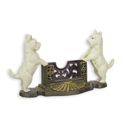 A CAST IRON CARD HOLDER FLANKED BY TWO SCOTTIES