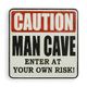 A CAST IRON CAUTION MAN CAVE" PLAQUE"