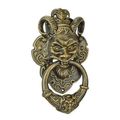 A CAST IRON DEVIL FACE DOOR KNOCKER - BRONZE COLOUR