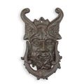 A CAST IRON DEVIL FACE DOOR KNOCKER