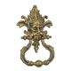 A CAST IRON DOOR KNOCKER - BRONZE COLOUR