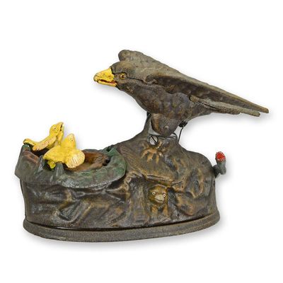 A CAST IRON EAGLE FEEDING HER EAGLETS MECHANICAL BANK