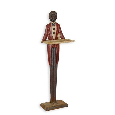 A CAST IRON FIGURAL BUSINESS CARD HOLDER