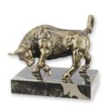 A CAST IRON FIGURINE OF A BULL ON MARBLE BASE