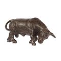 A CAST IRON FIGURINE OF A BULL