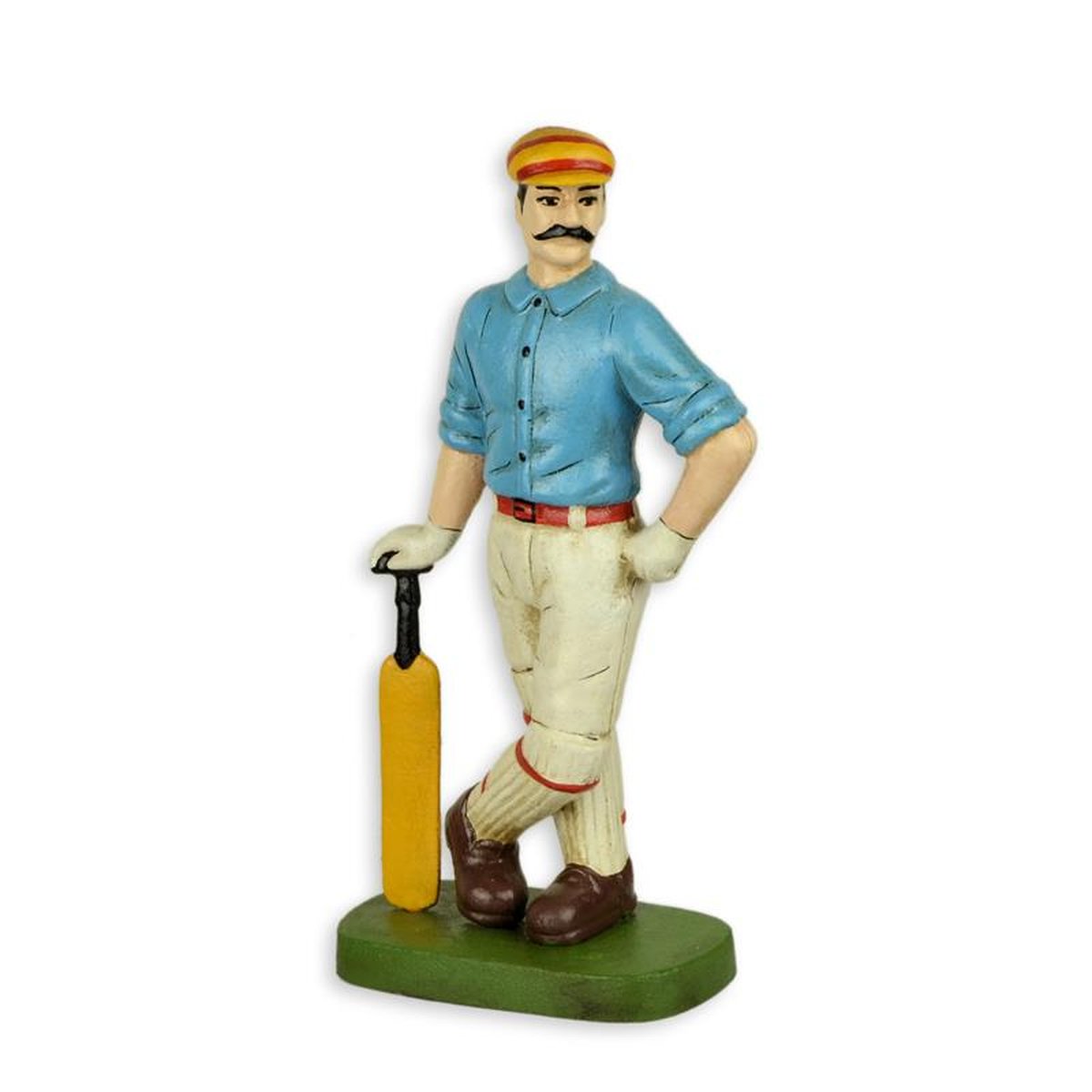 A CAST IRON FIGURINE OF A CRICKET PLAYER