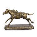A CAST IRON FIGURINE OF A GALLOPING HORSE