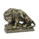 A CAST IRON FIGURINE OF A LION AND HOG