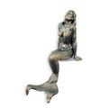 A CAST IRON FIGURINE OF A MERMAID