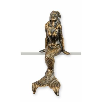A CAST IRON FIGURINE OF A MERMAID