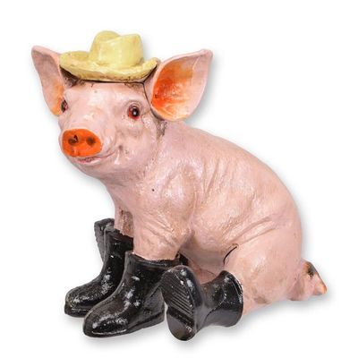A CAST IRON FIGURINE OF A PIG IN BOOTS