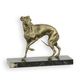 A CAST IRON FIGURINE OF A WHIPPET ON MARBLE BASE