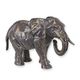 A CAST IRON FIGURINE OF AN ELEPHANT