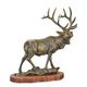 A CAST IRON FIGURINE OF AN ELK ON WOODEN BASE
