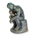 A CAST IRON FIGURINE OF THE THINKER - ANTIQUE GREEN