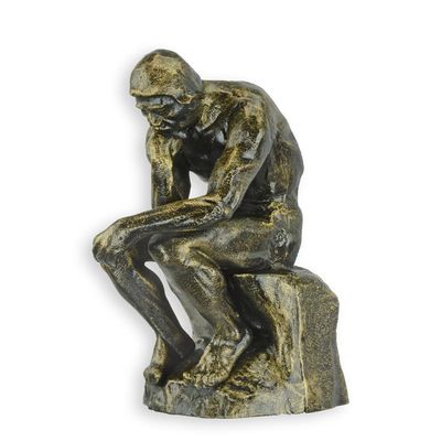 A CAST IRON FIGURINE OF THE THINKER""