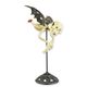 A CAST IRON FLYING SKELETON VAMPIRE ON STAND