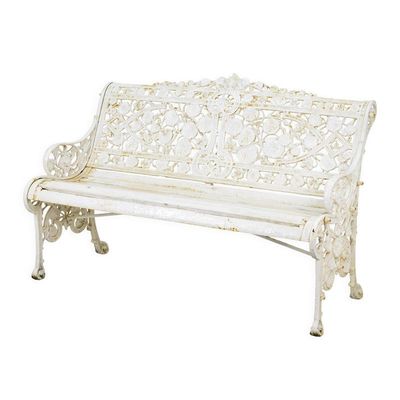 A CAST IRON GARDEN BENCH