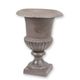 A CAST IRON GARDEN URN - BROWN