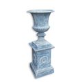 A CAST IRON GARDEN URN ON A BASE