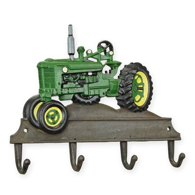 A CAST IRON GREEN TRACTOR COAT HOOK