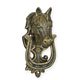 A CAST IRON HORSE HEAD DOOR KNOCKER, BRONZE COLOR