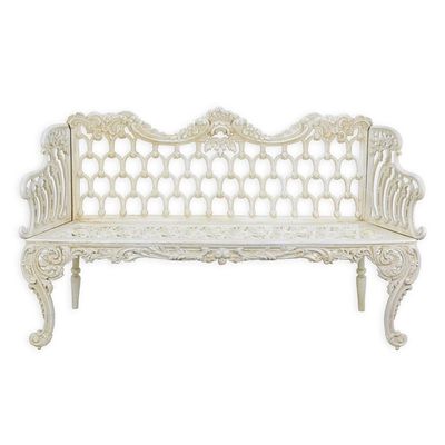 A CAST IRON HORSE SHOE GARDEN BENCH
