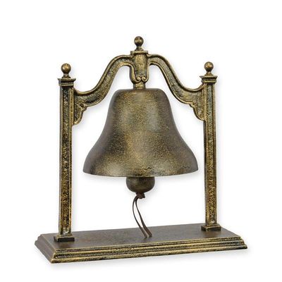A CAST IRON HOTEL BELL ON STAND
