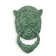 A CAST IRON LION HEAD DOOR KNOCKER