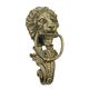 A CAST IRON LION HEAD DOOR KNOCKER