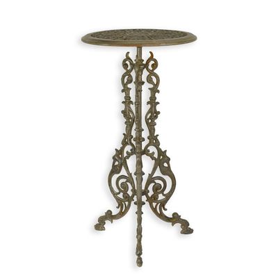 A CAST IRON PLANT TABLE - BROWN