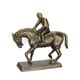 A CAST IRON SCULPTURE OF A JOCKEY ON HORSE