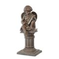 A CAST IRON SCULPTURE OF A PUTTO SITTING ON A PILLAR