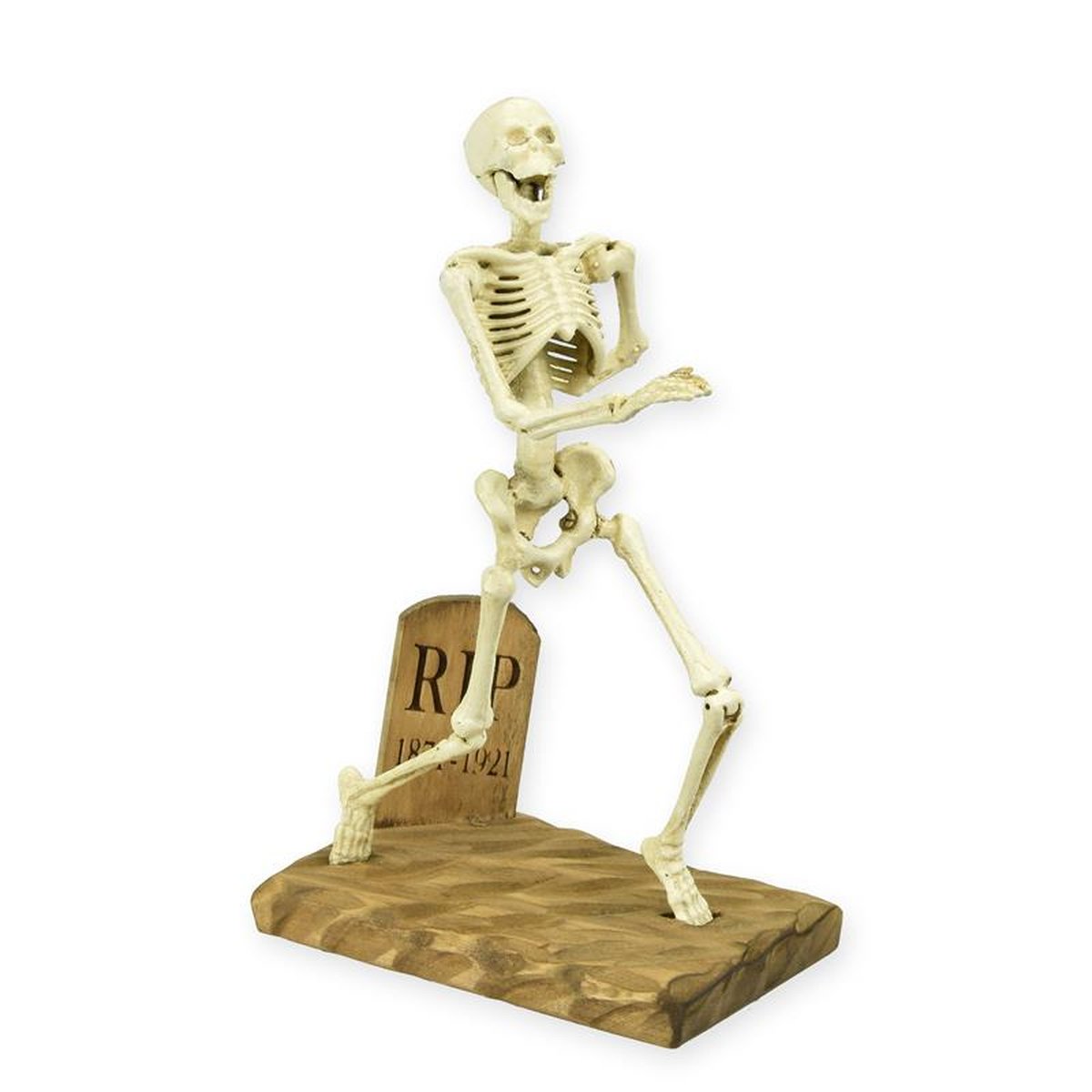 A CAST IRON SKELETON MOUNTED ON A WOODEN BASE