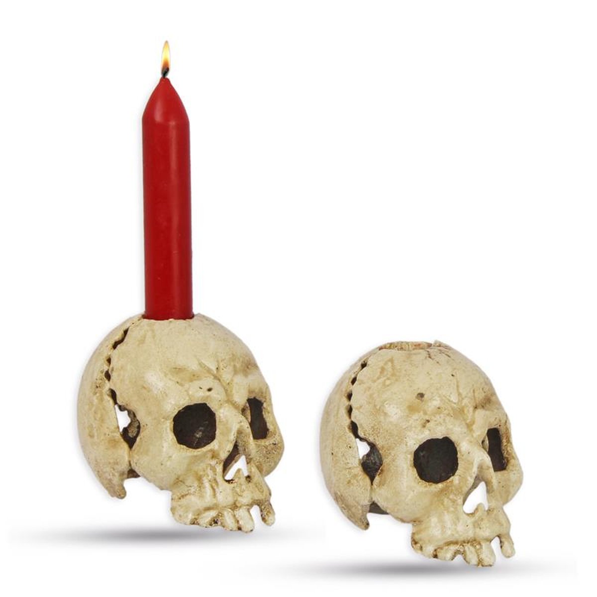 A CAST IRON SKULL CANDLE HOLDER, OLD WHITE