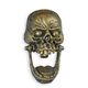 A CAST IRON SKULL DOOR KNOCKER