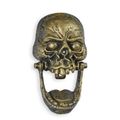 A CAST IRON SKULL DOOR KNOCKER