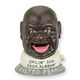 A CAST IRON SMILIN' SAM MECHANICAL BANK