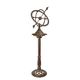 A CAST IRON SUNDIAL ON STAND