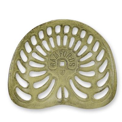 A CAST IRON TRACTOR SEAT, BROWN