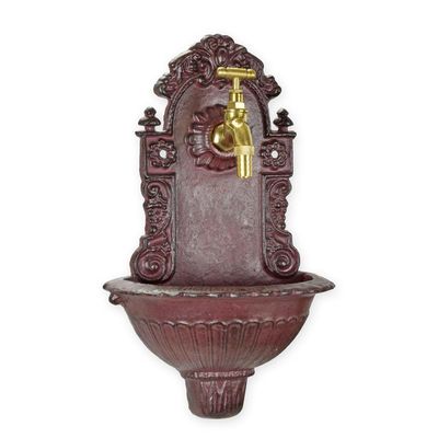 A CAST IRON WALL FOUNTAIN