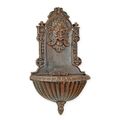 A CAST IRON WALL FOUNTAIN